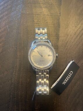 Citizen Silver-Tone Men’s Eco-Drive Watch with Crystal Bezel